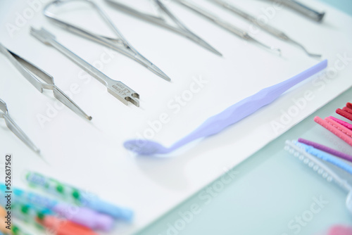 Sterile instruments of the orthodontist lie on the surgical table