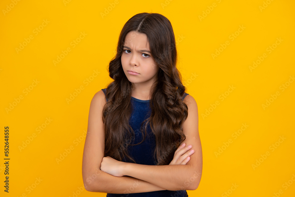 Angry teenager girl, upset and unhappy negative emotion. Headshot portrait of teenager child girl isolated on studio background. Childhood lifestyle concept. Mock up copy space. Angry teenager girl, upset and unhappy negative emotion. Headshot portrait of teenager child girl isolated on studio background. Childhood lifestyle concept. Mock up copy space.
