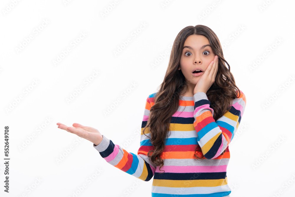 Surprised face, surprise emotions of teenager girl. Close-up portrait of her she nice cute attractive cheerful amazed girl pointing aside on copy space isolated on white background. Surprised face, surprise emotions of teenager girl. Close-up portrait of her she nice cute attractive cheerful amazed girl pointing aside on copy space isolated on white background.