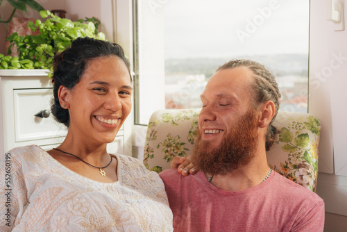 Photo of cheerful excited glad careless happy couple smiling brunette attractive woman and with stylish hairdo man.