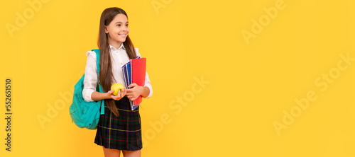 schoolgirl with apple and backpack. back to school. teen girl ready to study. Portrait of schoolgirl student, studio banner header. School child face, copyspace.