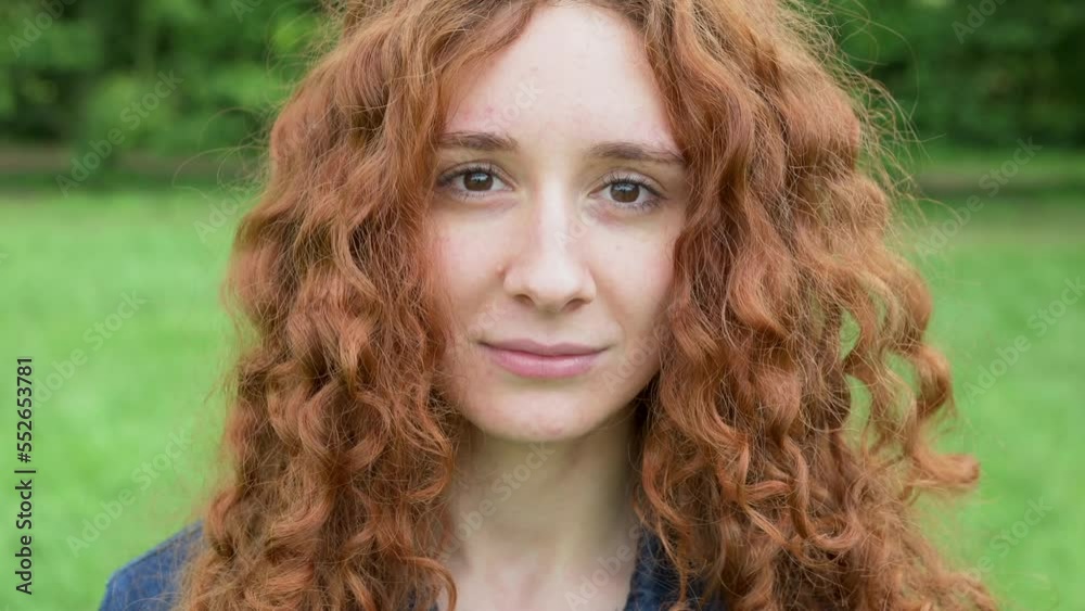 Video portrait of a young red head woman, toothy smile and laugh Video portrait of a young red head woman, toothy smile and laugh