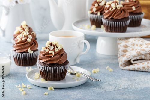 Chocolate cupcakes with sweet chocolate ganashe frosting photo