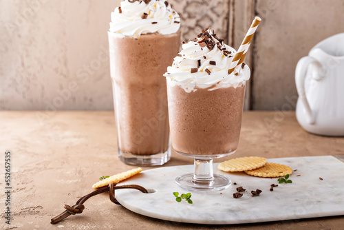 Coffee frappe topped with whipped cream and chocolate curls photo