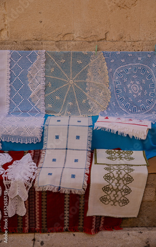 Obraz na płótnie Lace for sale. Lace is sold on the streets of the old town. Lace patterns for every taste. Needlework as a gift. Handwork - a great value w salonie