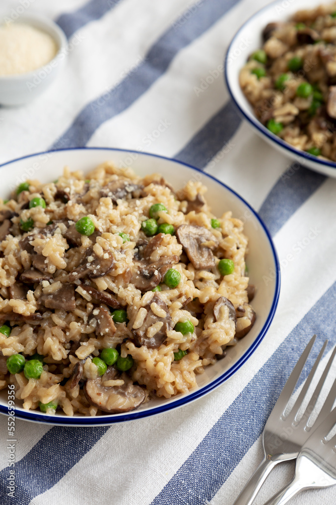 Homemade Mushroom Risotto with Peas on a Plate, side view. Homemade Mushroom Risotto with Peas on a Plate, side view.