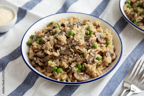 Homemade Mushroom Risotto with Peas on a Plate, side view.