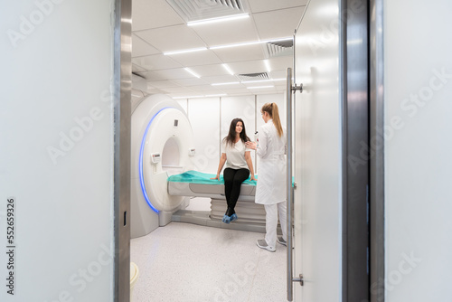 Medical CT or MRI Scan with a patient in the modern hospital laboratory. Interior of radiography department. Technologically advanced equipment in white room. Magnetic resonance diagnostics machine photo