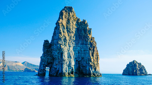 Aeolian Islands, Sicily. Sea stacks at Lipari island, and Vulcano island in the background. photo