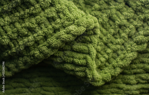 Obraz na płótnie Monochrome background of cozy green knitted sweater w salonie