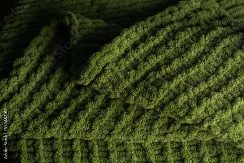 Obraz na płótnie Monochrome background of cozy green knitted sweater w salonie