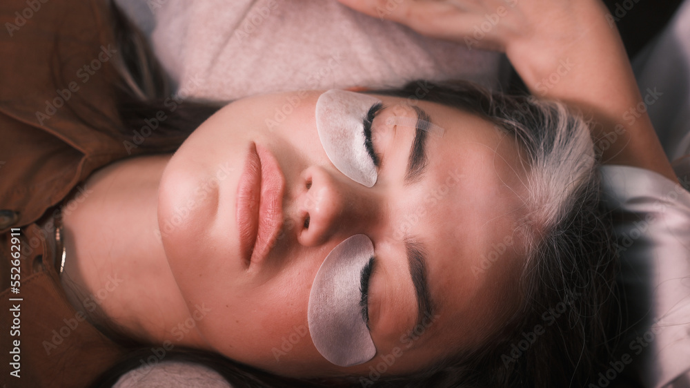 Girl with eye pads and glued eyelashes Girl with eye pads and glued eyelashes