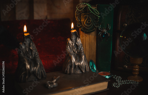 Fototapeta Naklejka Na Ścianę i Meble -  Concept removing bad negative energy, candles and other magical elements on a table, vintage elements 