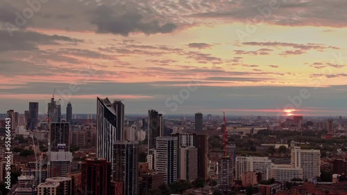 Establishing Aerial Drone Helicopter View Of London City Skyline and  Strata SE1 Building, London Skyscraper UK, United Kingdom At Sunset  photo