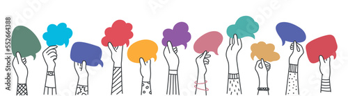 Group of arms and raised hands of diverse people holding a speech bubble.