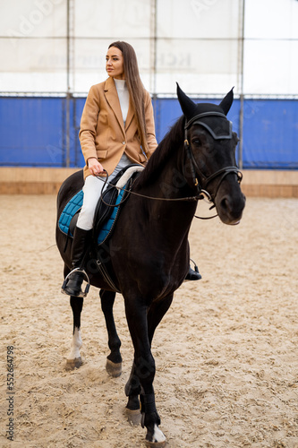 Horse riding pretty woman. Lifestyle hobby outdoor horse rider.