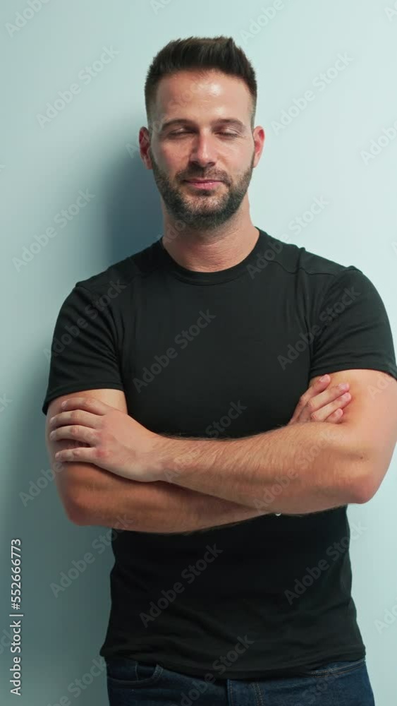 Portrait of happy casual man smiling, Young guy standing at white wall, Isolated on white background, copy space. Portrait of happy casual man smiling, Young guy standing at white wall, Isolated on white background, copy space.