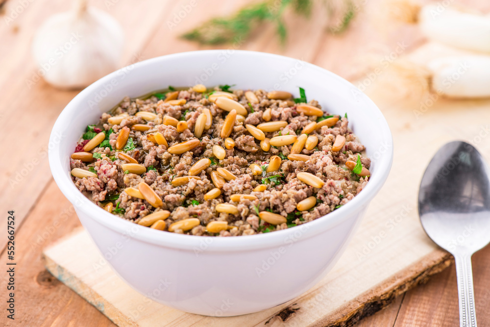 Fatteh with Meat served in dish isolated on table side view of arabic food