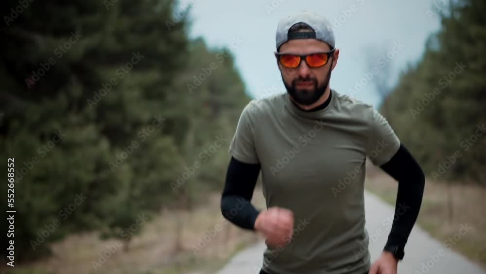 Running man fitness exercising . Athlete jogging in city Running man fitness exercising . Athlete jogging in city