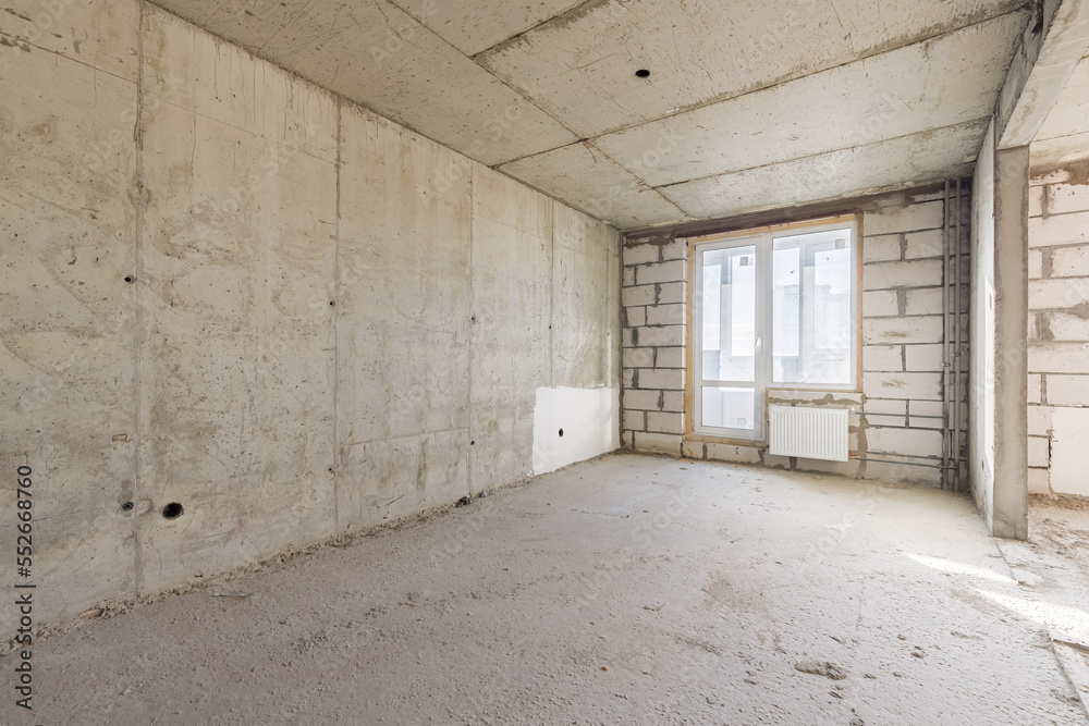 Empty concrete commercial space without finishing with partitions