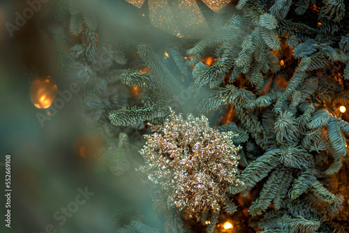 Shot Of Illuminated Christmas decorations on Christmas tree. Winter Holidays Concept