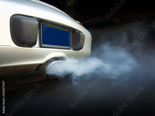 Polluting exhaust coming out of car tailpipe © Christian Delbert