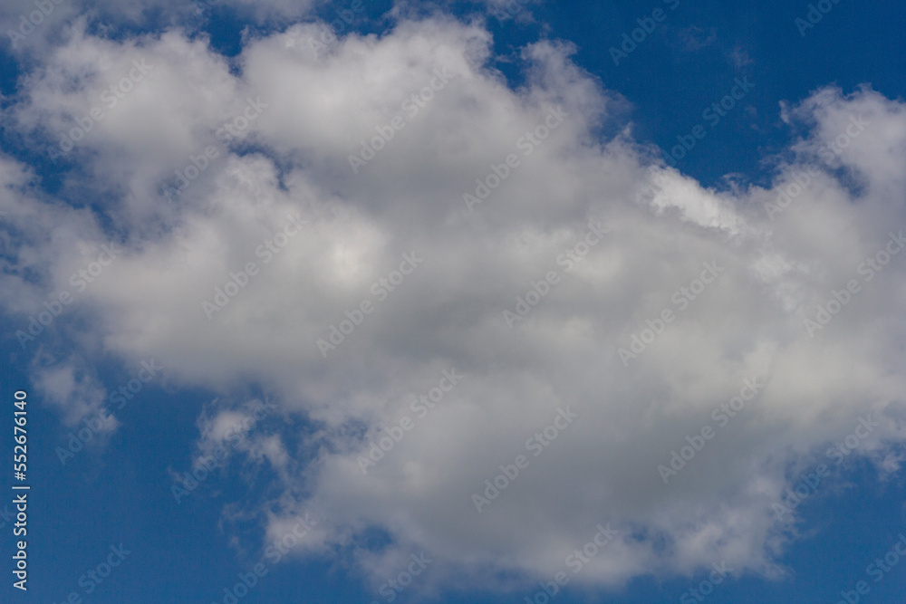 blue sky, with small clouds on a sunny summer day.