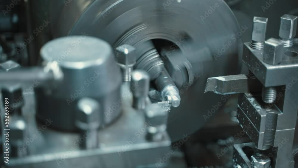 Facing operation of a metal blank on turning machine with cutting tool. Facing operation of a metal blank on turning machine with cutting tool.