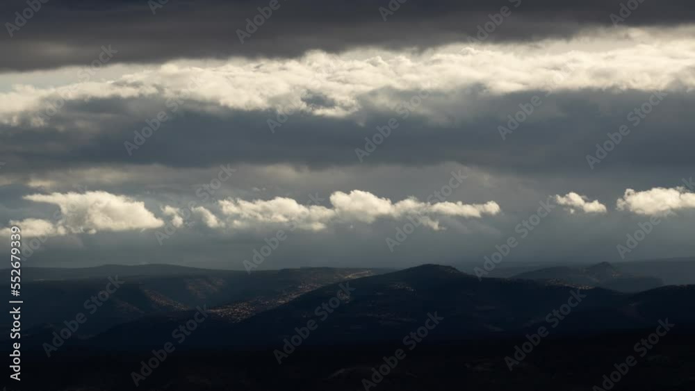 Illuminated Clouds in Dark Storm over Landscape Timelapse Illuminated Clouds in Dark Storm over Landscape Timelapse