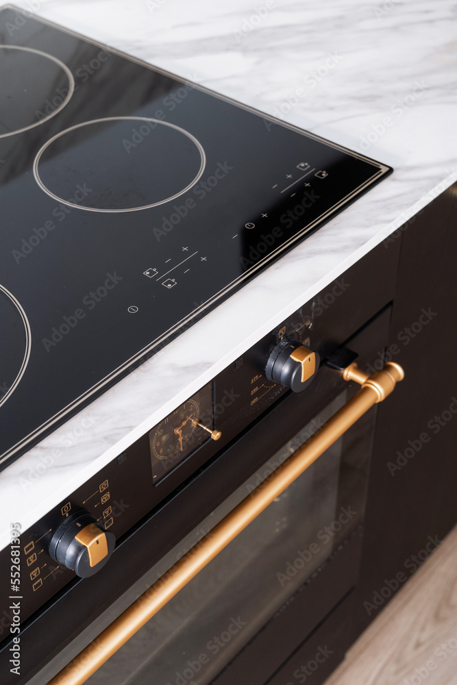 Fototapeta premium glass ceramic stove, modern household appliances at kitchen