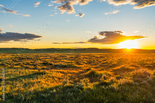 Bright golden sunset in Grasslands National Park; Val Marie, Saskatchewan, Canada photo