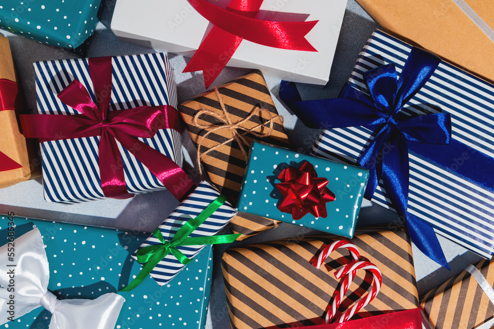 Fototapeta premium Many different Christmas gifts on grey background.