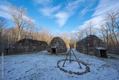 Woman walking at the Ska-Nah-Doht Village in Longwoods Conservation Area near London, Ontario; Mount Brydges, Ontario, Canada photo