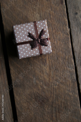 Gift with ribbonon a beautiful vintage table. photo