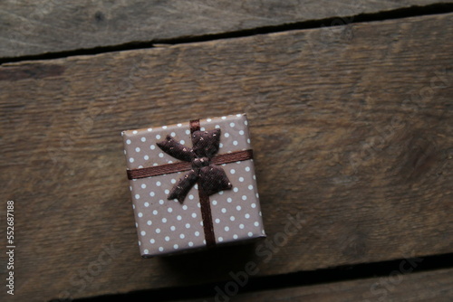 Gift with ribbonon a beautiful vintage table. photo