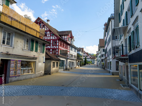 A historic alley with old half-timbered houses.