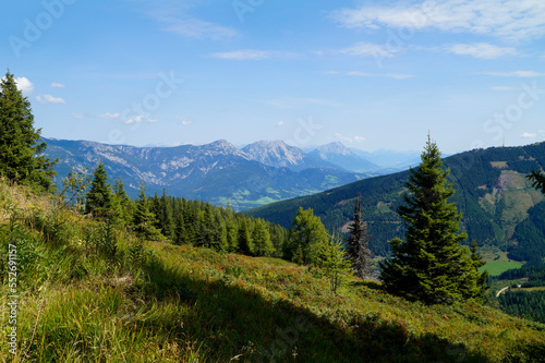 a hiking trail overlooking the picturesque alpine landscape by the foot of Dachstein mountain in the Austrian Alps of the Schladming-Dachstein region (Steiermark or Styria, Austria)