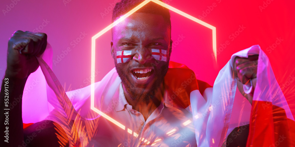 African american male fan with england flag and face paint screaming by hexagon and plants African american male fan with england flag and face paint screaming by hexagon and plants