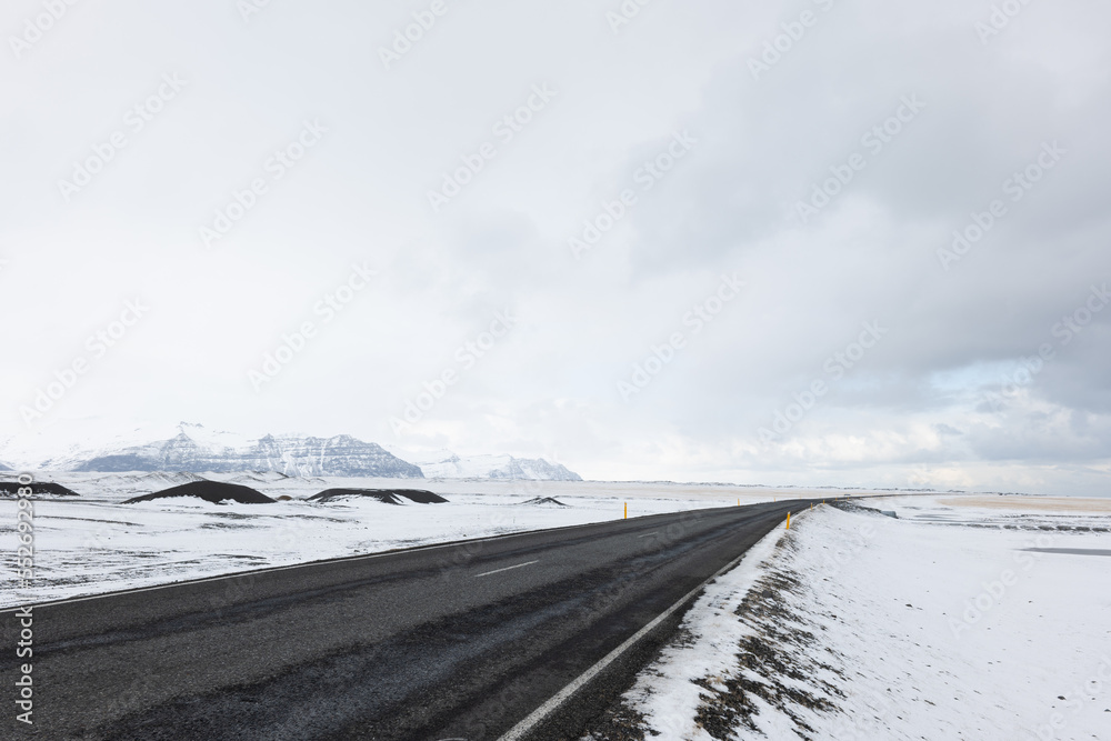 Road LEading Through the Frozen Snowy Landscape of Southern Iceland in Winter Road LEading Through the Frozen Snowy Landscape of Southern Iceland in Winter