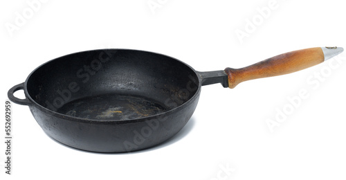 Empty black round metal pan on a white isolated background
