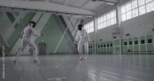 Anonymous women during fencing workout