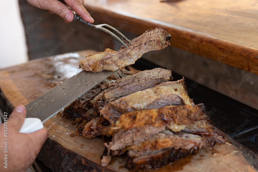 Argentinian grilled meat cooking - asado argentino Argentinian grilled meat cooking - asado argentino