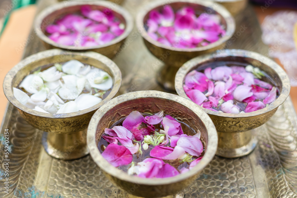 purple rose and white jasmine flowers put into water as a requirements before Siraman ritual in traditional Javanese wedding ceremony. purple rose and white jasmine flowers put into water as a requirements before Siraman ritual in traditional Javanese wedding ceremony.
