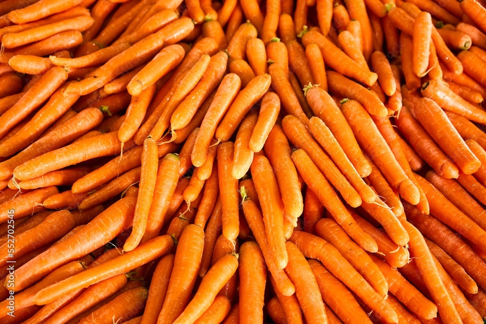 Many carrots placed raw in a container, overhead photo. High quality photo Many carrots placed raw in a container, overhead photo. High quality photo