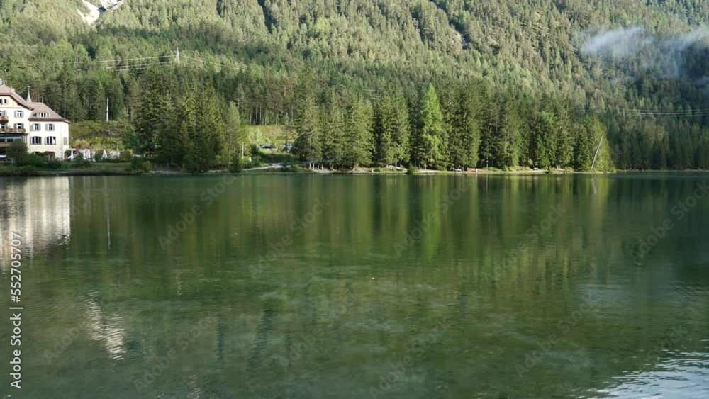 Autumn morning after the rain by the lake of Dobbiaco(Toblacher See). South Tyrol, province of Bolzano. Dolomites, Italy. Autumn morning after the rain by the lake of Dobbiaco(Toblacher See). South Tyrol, province of Bolzano. Dolomites, Italy.