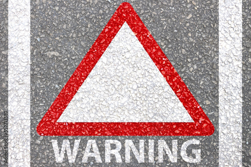 Red Triangle is warning symbols sign for drivers advice painted on road .