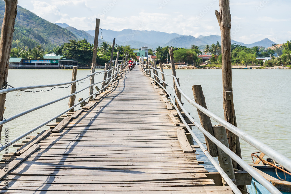 A rustic wooden bridge over a river at Nha Trang in Vietnam A rustic wooden bridge over a river at Nha Trang in Vietnam