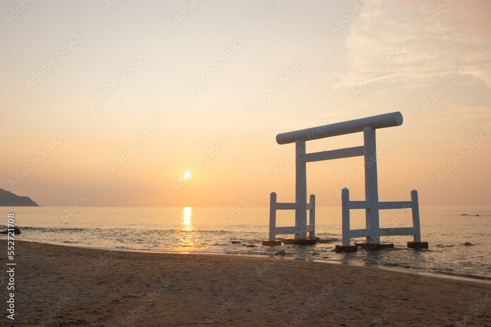 Meotoiwa and White Torii Gate at sunset at Itoshima Bay, Fukuoka Prefecture, Japan