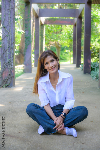 Free Download Asian woman wearing white shirt in the park - GFXLoad