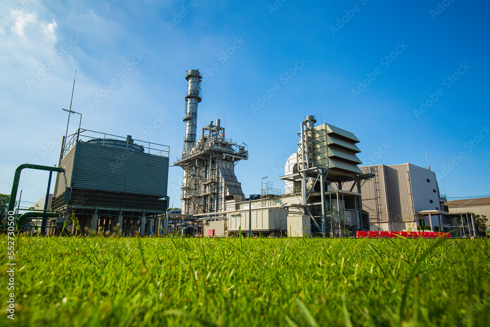 Gas turbine electrical power plant during the field green. Electric current distribution substation